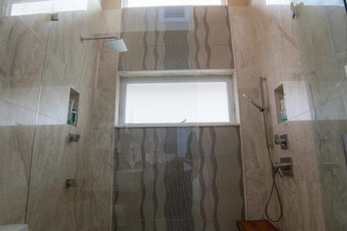 Mid-sized minimalist master beige tile and stone slab marble floor walk-in shower photo in Miami with flat-panel cabinets, medium tone wood cabinets, a one-piece toilet, a trough sink and marble countertops