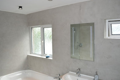 Design ideas for a contemporary bathroom in Other with grey tiles and cement tiles.