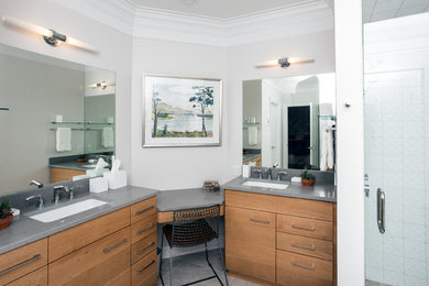 Inspiration for a mid-sized modern master white tile and porcelain tile porcelain tile and gray floor drop-in bathtub remodel in Raleigh with flat-panel cabinets, light wood cabinets, multicolored walls, an undermount sink, quartz countertops, a hinged shower door and gray countertops
