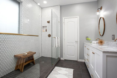 Example of a small minimalist 3/4 white tile and porcelain tile porcelain tile and gray floor double shower design in Dallas with shaker cabinets, white cabinets, a drop-in sink and marble countertops