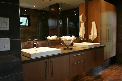 Example of a large minimalist master brown tile porcelain tile bathroom design in Toronto with flat-panel cabinets, medium tone wood cabinets, brown walls and a drop-in sink