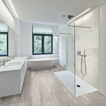 Modern bathroom with light wood look porcelain tiled floor and stone look shower