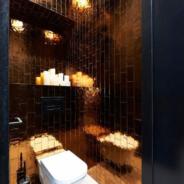 Modern bathroom with metallic copper colored subway tiles