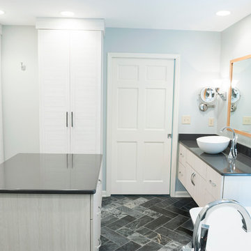 Modern Bathroom with Open Dressing Area, Floating Vanity, & Herringbone Tile