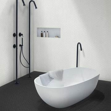 Modern black and white bathroom with hexagon porcelain tiled walls and floor