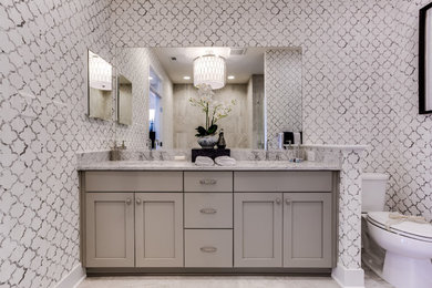 Inspiration for a mid-sized modern master ceramic tile and gray floor bathroom remodel in DC Metro with shaker cabinets, gray cabinets, gray walls, marble countertops, an undermount sink and a two-piece toilet