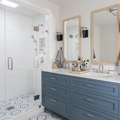 Large transitional master white tile and subway tile mosaic tile floor, multicolored floor and double-sink alcove shower photo in San Francisco with furniture-like cabinets, blue cabinets, an undermount sink, quartz countertops, a hinged shower door, white countertops and a freestanding vanity