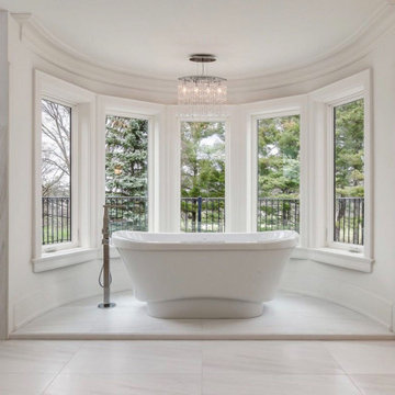 Modern custom master bathroom with freestanding tub