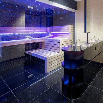 Modern dark bathroom with engineered terrazzo and glass mosaics