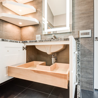 Large minimalist master gray tile and ceramic tile ceramic tile and gray floor bathroom photo in Chicago with raised-panel cabinets, white cabinets, a wall-mount toilet, gray walls, an undermount sink, quartzite countertops and a hinged shower door