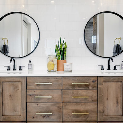 Inspiration for a large cottage master porcelain tile and white tile marble floor and white floor bathroom remodel in Boise with shaker cabinets, medium tone wood cabinets, white walls, an undermount sink, quartz countertops and white countertops