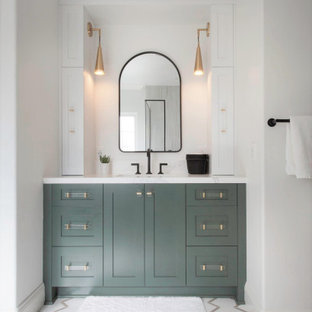 Inspiration for a mid-sized master white tile and porcelain tile porcelain tile, white floor, single-sink, wallpaper ceiling and wallpaper bathroom remodel in San Diego with recessed-panel cabinets, green cabinets, a two-piece toilet, white walls, an undermount sink, quartz countertops, a hinged shower door, white countertops and a built-in vanity