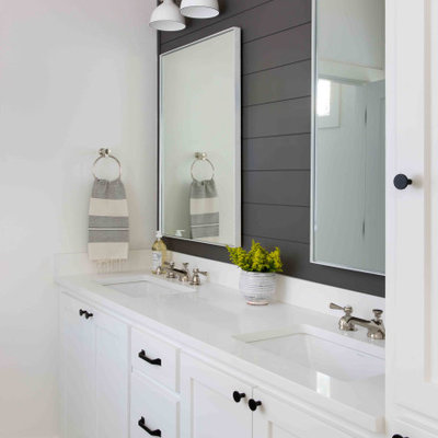 Inspiration for a mid-sized country 3/4 porcelain tile and gray floor bathroom remodel in Austin with shaker cabinets, white cabinets, white walls, an undermount sink and white countertops