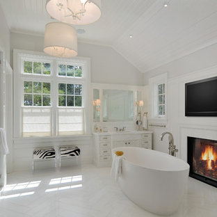 Freestanding bathtub - country master freestanding bathtub idea in San Francisco with white cabinets, gray walls, an undermount sink and a hinged shower door