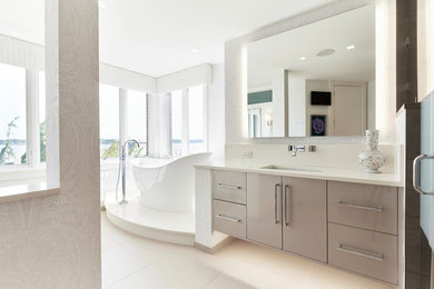 Large minimalist master porcelain tile and beige floor bathroom photo in Other with flat-panel cabinets, gray cabinets, an undermount sink, quartz countertops and a hinged shower door