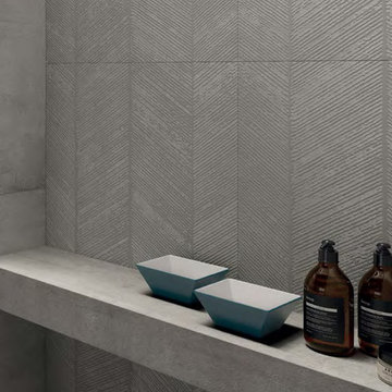 Modern grey bathroom with cement look porcelain tiled walls and floor