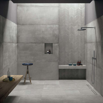 Modern grey bathroom with cement look porcelain tiled walls and floor
