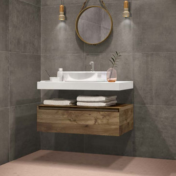 Modern grey bathroom with mosaic floors and cement look walls