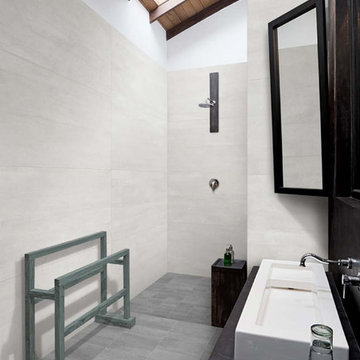 Modern grey black and white bathroom with stone look tile