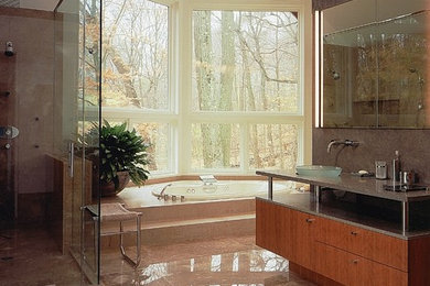 Inspiration for a large modern master bathroom remodel in New York with flat-panel cabinets, medium tone wood cabinets and a vessel sink