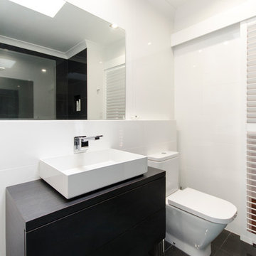 Modern inner city bathroom/laundry before and after