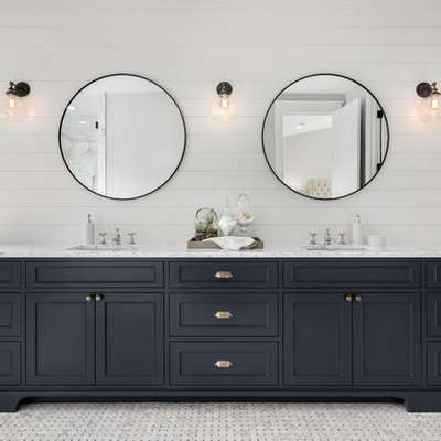 Cottage master gray floor freestanding bathtub photo in DC Metro with beaded inset cabinets, black cabinets, white walls, an undermount sink and white countertops