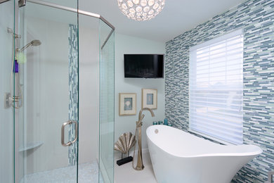 Inspiration for a small contemporary master glass tile and blue tile porcelain tile bathroom remodel in Denver with flat-panel cabinets, white cabinets, quartz countertops, blue walls and a vessel sink