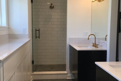 Inspiration for a medium sized modern ensuite bathroom in Minneapolis with dark wood cabinets, an alcove shower, white tiles, metro tiles, white walls, mosaic tile flooring, flat-panel cabinets, a submerged sink and marble worktops.