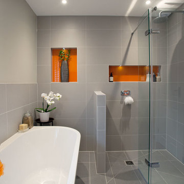 Modern, minimal family bathroom with orange accents - Burgess Hill