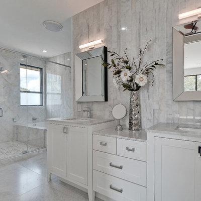 Large transitional master gray tile and marble tile marble floor and white floor alcove shower photo in Nashville with shaker cabinets, white cabinets, an undermount sink, an undermount tub, a one-piece toilet, marble countertops, gray walls, a hinged shower door and white countertops