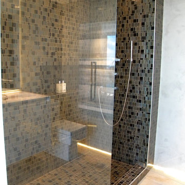 Modern walk in shower with glass mosaics