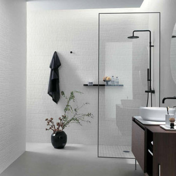 Modern white bathroom with white textured porcelain tile walls