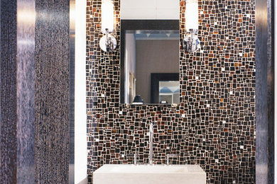 Inspiration for a huge modern master brown tile and glass tile ceramic tile double shower remodel in New York with flat-panel cabinets, dark wood cabinets, a two-piece toilet, white walls, a pedestal sink and limestone countertops