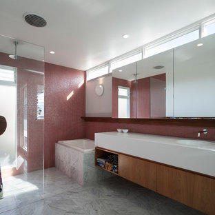 Design ideas for a small contemporary 3/4 bathroom in Sydney with flat-panel cabinets, brown cabinets, a japanese tub, an open shower, a wall-mount toilet, red tile, mosaic tile, grey walls, marble floors, an integrated sink, solid surface benchtops, grey floor, an open shower and yellow benchtops.