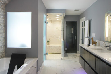 Bathroom - mid-sized modern master black and white tile and porcelain tile porcelain tile and white floor bathroom idea in Atlanta with flat-panel cabinets, medium tone wood cabinets, a bidet, gray walls, an undermount sink, quartz countertops, a hinged shower door and white countertops