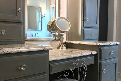 Inspiration for a mid-sized transitional master white tile and ceramic tile ceramic tile and gray floor walk-in shower remodel in Other with recessed-panel cabinets, quartz countertops, a hinged shower door, multicolored countertops, gray cabinets, a one-piece toilet and an undermount sink