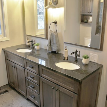 Moline, IL Bath Remodel With Gray Stained Cherry Vanity and Pebble Tiled Shower