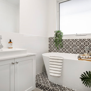 Transitional 3/4 bathroom in Melbourne with shaker cabinets, white cabinets, a freestanding tub, black and white tile, gray tile, white walls, a vessel sink, marble benchtops, multi-coloured floor, multi-coloured benchtops, a single vanity, a built-in vanity and ceramic tile.