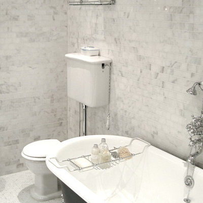 Bathroom - large eclectic master white tile and stone tile marble floor bathroom idea in New York with a console sink, a two-piece toilet, quartz countertops, furniture-like cabinets and white walls