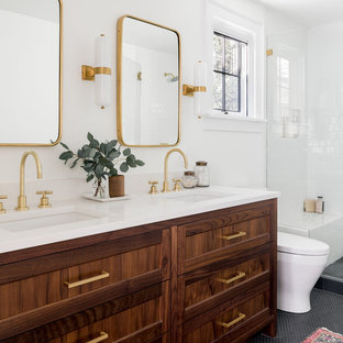 Inspiration for a transitional white tile and subway tile mosaic tile floor and black floor alcove shower remodel in Portland with shaker cabinets, dark wood cabinets, white walls, an undermount sink and white countertops