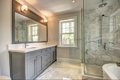This is an example of a bathroom in Toronto with a freestanding bath, a corner shower, white tiles, marble tiles, white walls, marble flooring, white floors and white worktops.