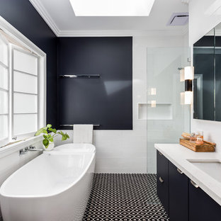 Inspiration for a mid-sized transitional master bathroom in Brisbane with flat-panel cabinets, blue cabinets, a freestanding tub, an alcove shower, subway tile, blue walls, porcelain floors, an undermount sink, engineered quartz benchtops, an open shower, white benchtops, white tile and multi-coloured floor.