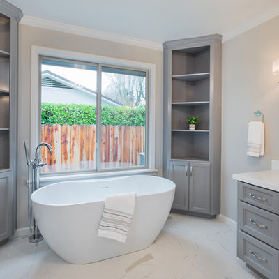 Large cottage chic porcelain tile freestanding bathtub photo in Sacramento with marble countertops