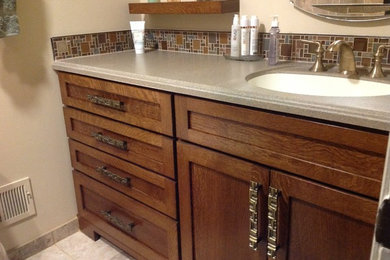 Bathroom - mid-sized transitional 3/4 beige tile, brown tile, green tile and glass tile bathroom idea in Detroit with shaker cabinets, medium tone wood cabinets, beige walls and an undermount sink