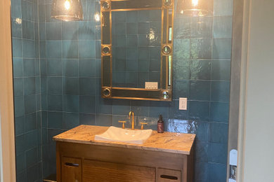 Mid-sized minimalist master blue tile and ceramic tile single-sink bathroom photo in New York with furniture-like cabinets, orange cabinets, blue walls and a freestanding vanity