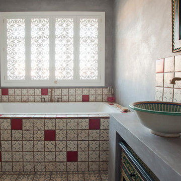 Moroccan-inspired bathroom with feature basin and cabinetry