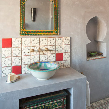 Moroccan-inspired bathroom with feature basin and cabinetry