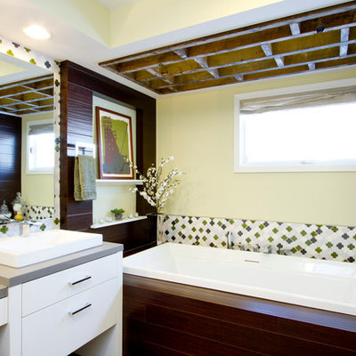 Large trendy master mosaic tile and multicolored tile porcelain tile bathroom photo in Minneapolis with a vessel sink, flat-panel cabinets, white cabinets, a one-piece toilet, white walls, quartzite countertops and gray countertops