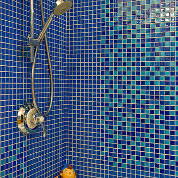 Mosaic glass tiled shower in the children's bathroom