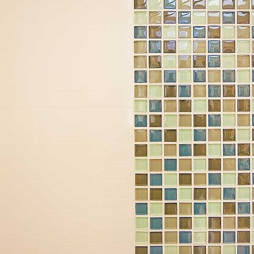 Mosaic tile next to smooth tile in shower enclosure